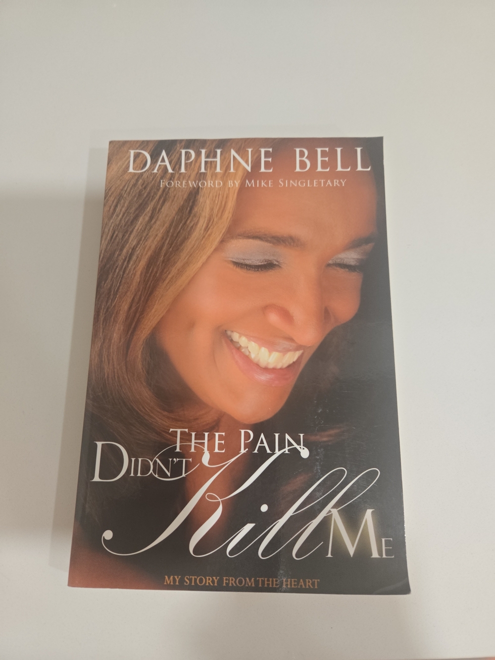 Daphne Bell "The Pain Didn't Kill Me" Hardcover Book - Brown Cover